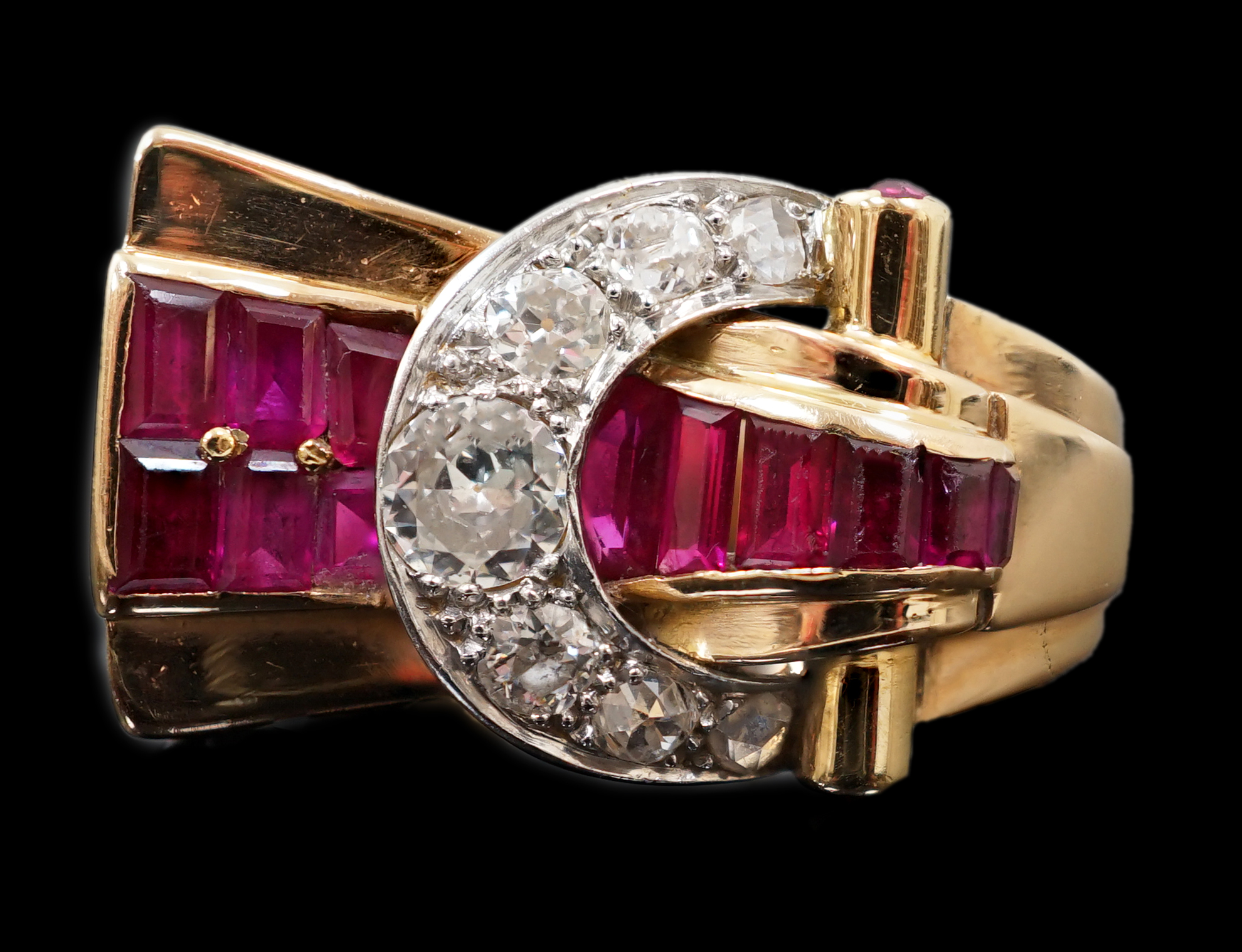 A 1950's continental gold, synthetic ruby, round and rose cut diamond cluster set fan shaped 'buckle' cocktail ring